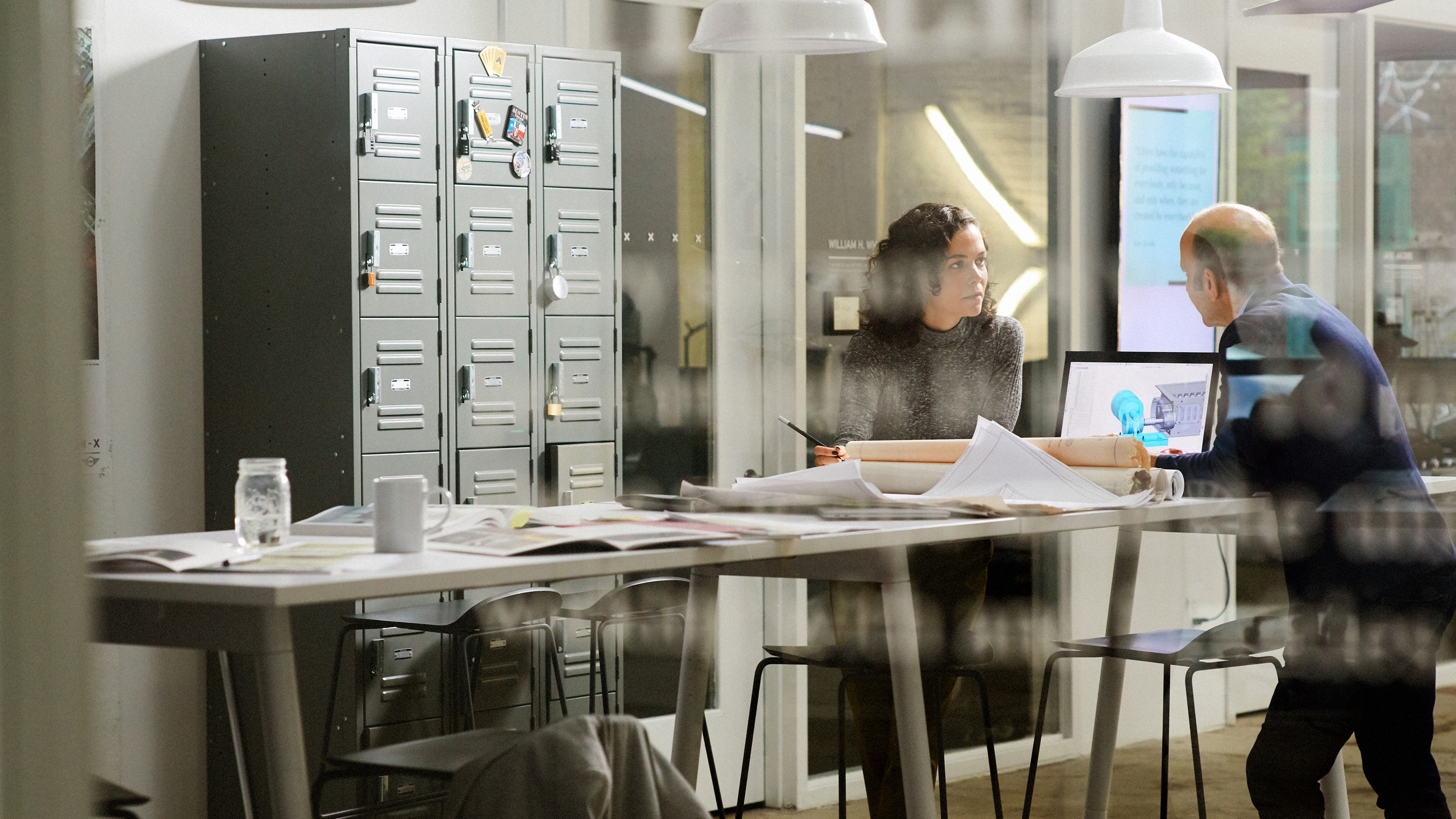 Two people have meeting at the MINI Urban X office.